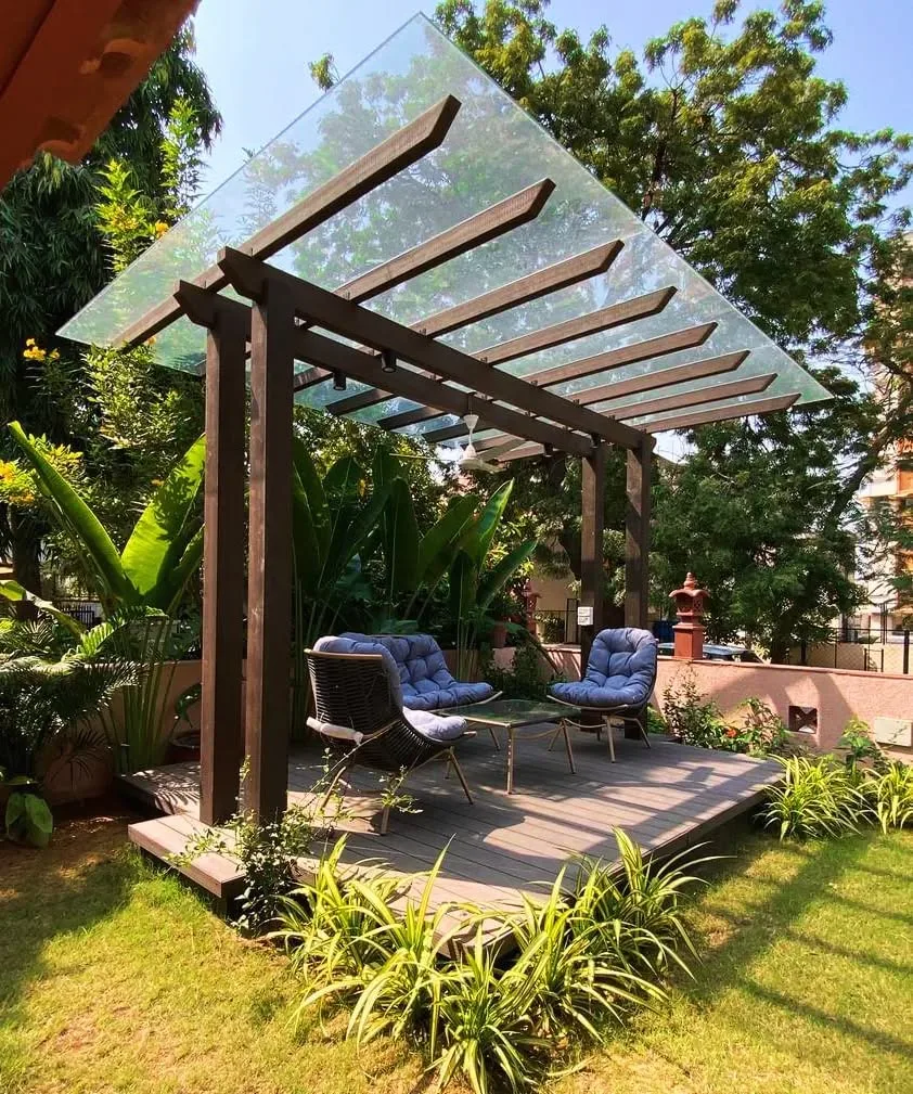 comfortable seating pergola glass roof garden