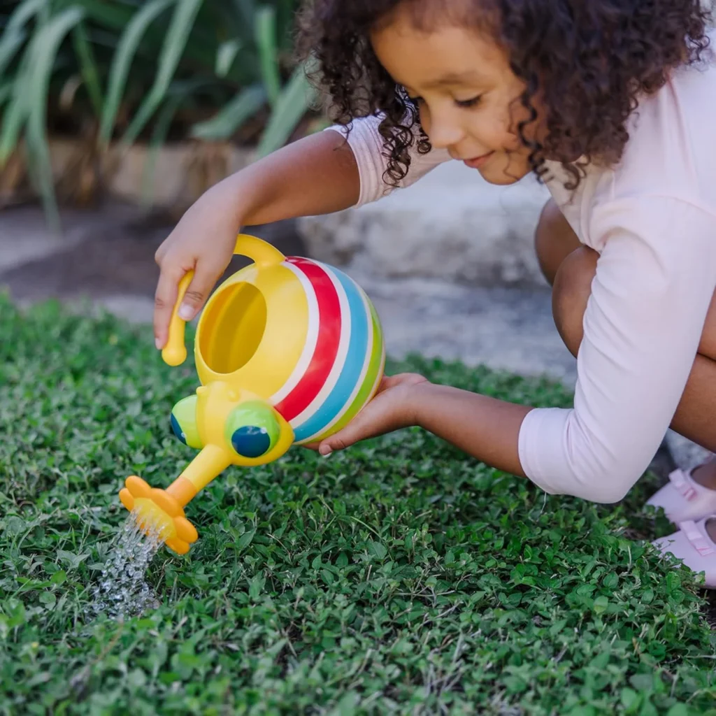 watering can with flower shaped spout