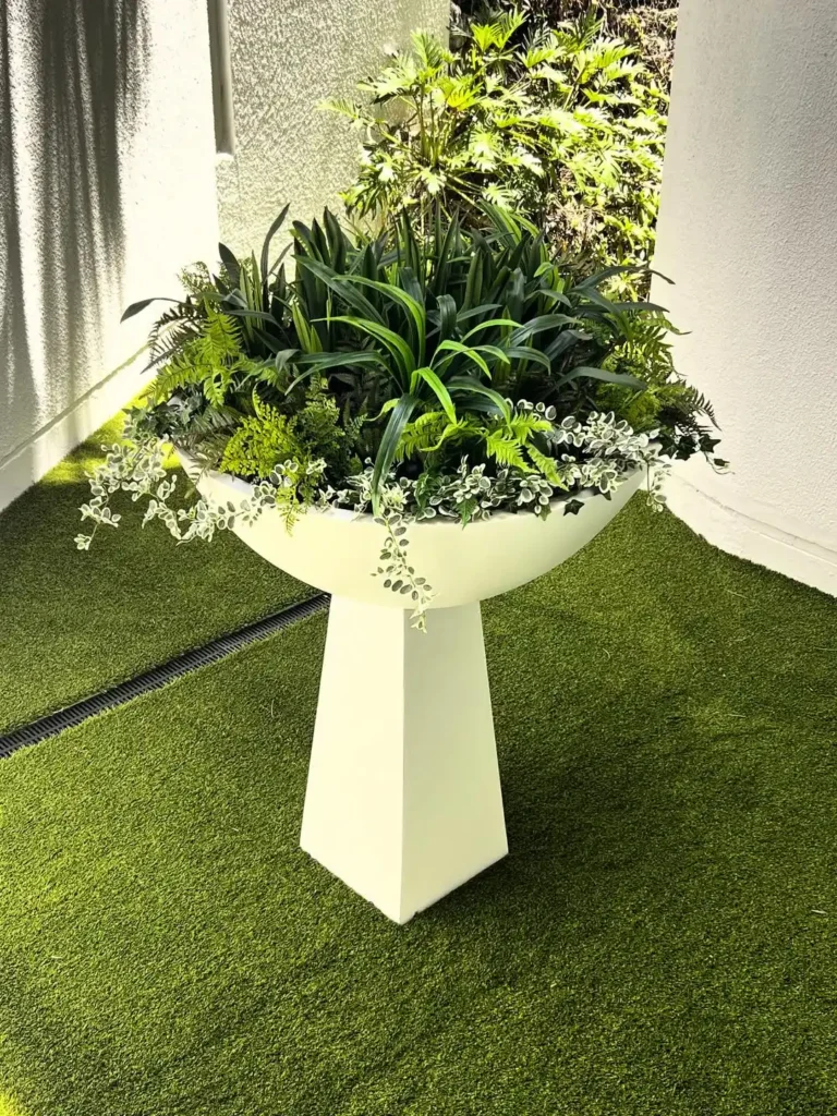 modern pedestal plant entrance